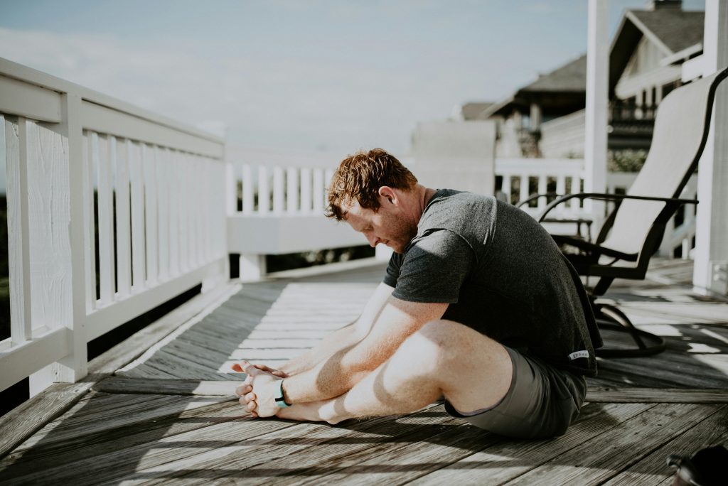 man performing the butterfly stretch